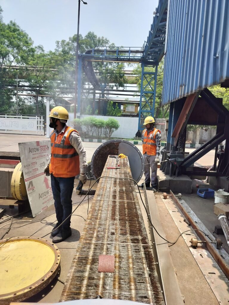 Two construction workers operating heavy machinery outdoors, wearing safety gear, emphasizing industrial work.